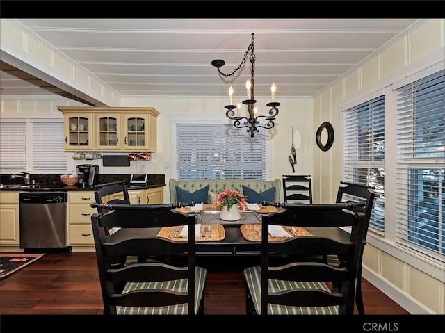 dining space featuring an inviting chandelier, dark hardwood / wood-style floors, and sink