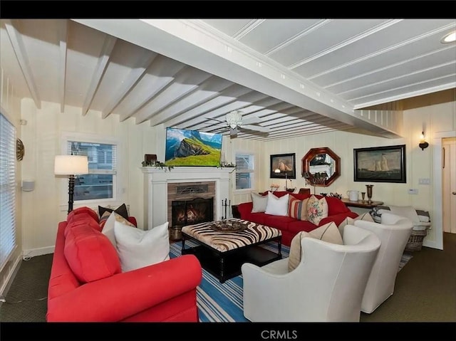 855 Lake Dr, Lake Arrowhead, CA 92352 - carpeted living area with a fireplace, ceiling fan, baseboards, and beamed ceiling