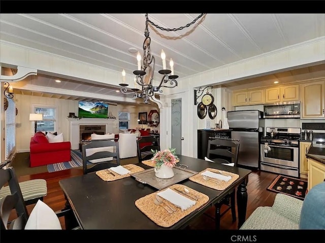 855 Lake Dr, Lake Arrowhead, CA 92352 - dining area with dark wood-style floors, a chandelier, and ornamental molding