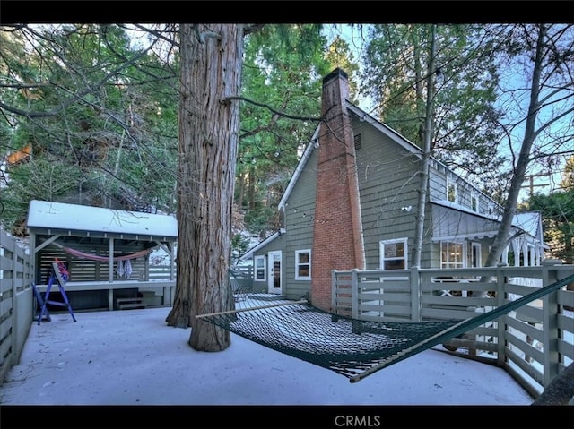 855 Lake Dr, Lake Arrowhead, CA 92352 - view of side of home with a chimney, a patio, and a wooden deck