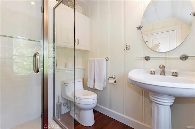855 Lake Dr, Lake Arrowhead, CA 92352 - full bath featuring a shower stall, toilet, and wood finished floors