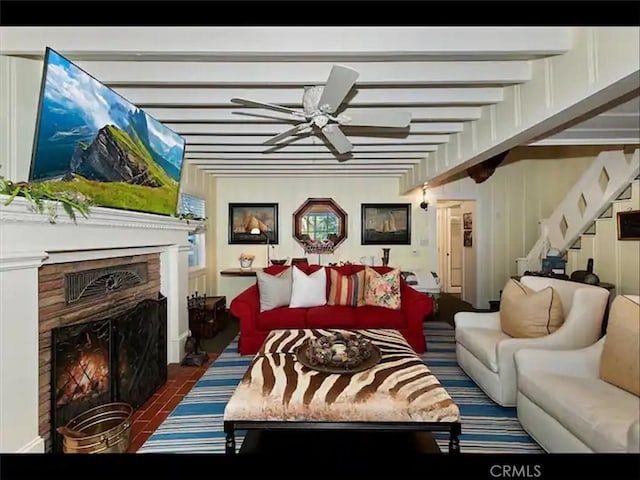 855 Lake Dr, Lake Arrowhead, CA 92352 - living room featuring a ceiling fan, stairs, and a warm lit fireplace