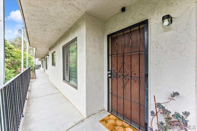 entrance to property with a balcony