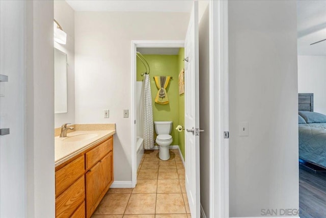 full bathroom with vanity, shower / bathtub combination with curtain, tile patterned floors, and toilet