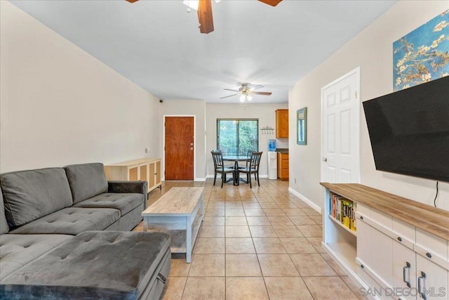 living room with ceiling fan and light tile patterned floors