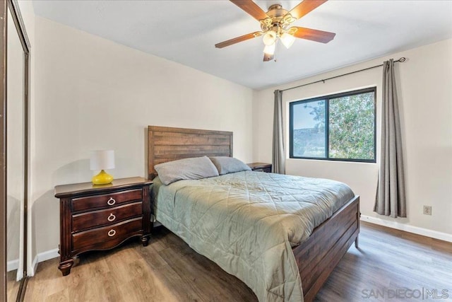 bedroom featuring wood-type flooring and ceiling fan