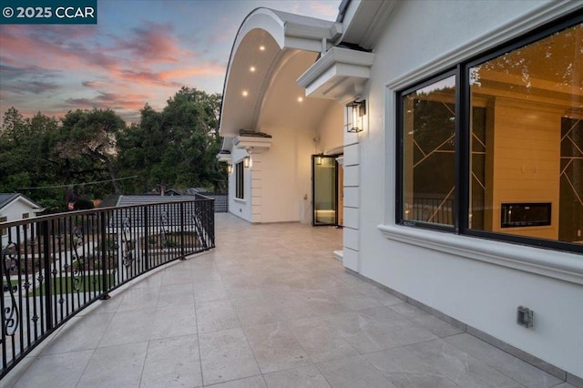 view of balcony at dusk