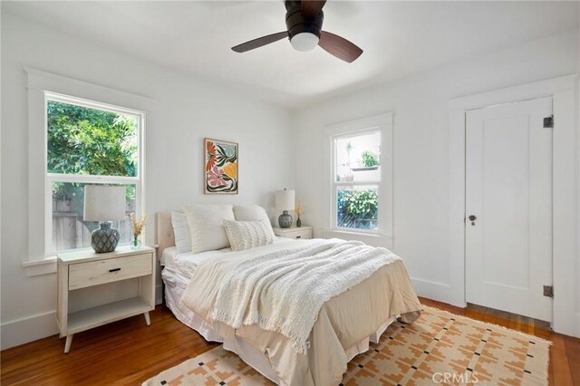 bedroom with light hardwood / wood-style flooring and ceiling fan