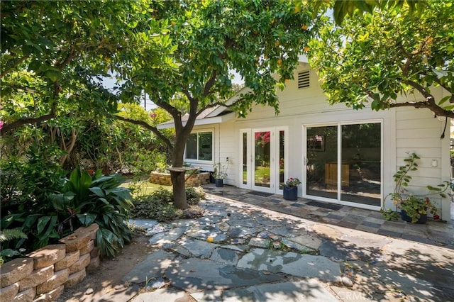 rear view of house with a patio