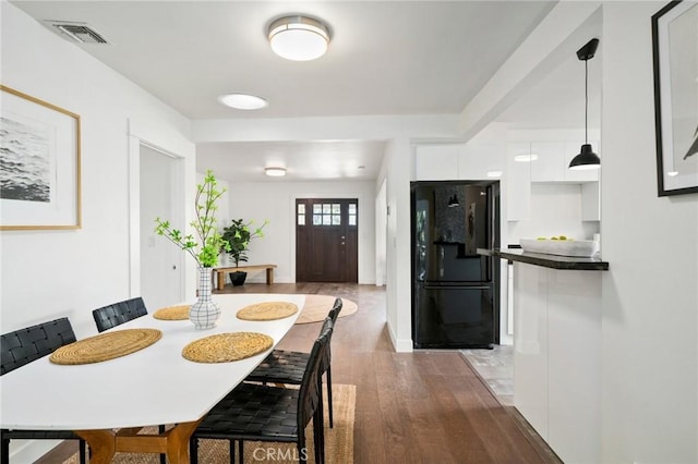 dining room featuring dark wood-type flooring