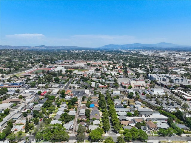 birds eye view of property with a mountain view