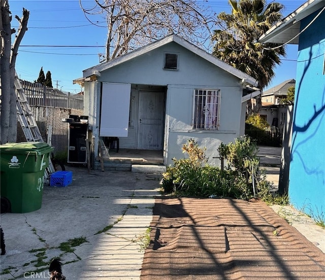 rear view of house with an outbuilding