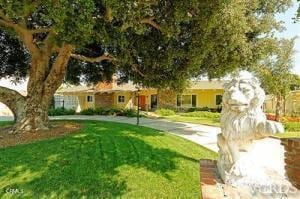 view of front of home with a front yard