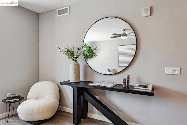 bathroom with hardwood / wood-style flooring and ceiling fan