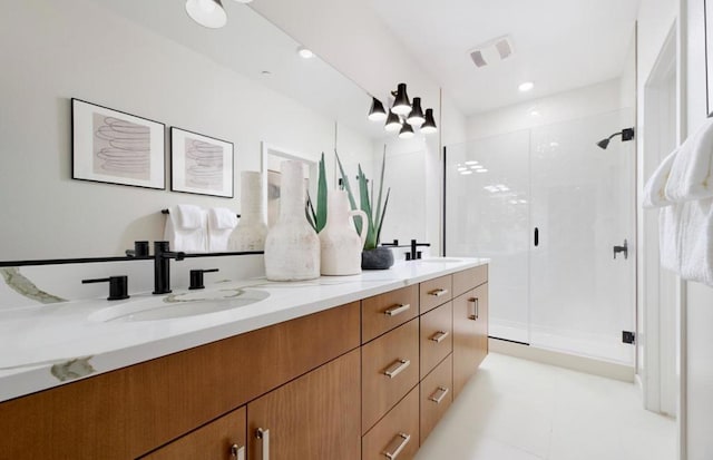 bathroom featuring vanity and a shower with shower door