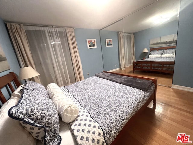 bedroom featuring hardwood / wood-style flooring