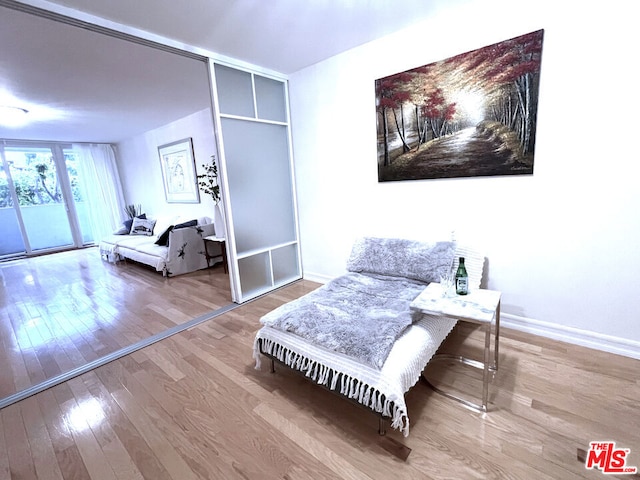 living area featuring hardwood / wood-style floors