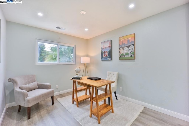 office space with light hardwood / wood-style flooring