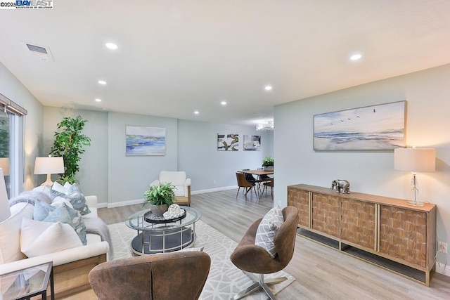 living room with light hardwood / wood-style floors