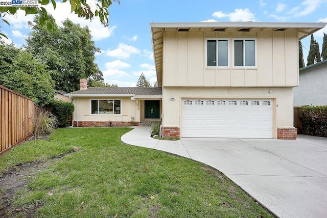 view of front of house with a garage and a front yard