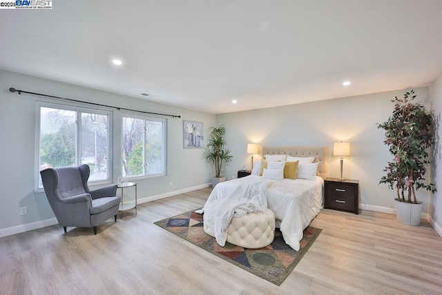 bedroom with light hardwood / wood-style flooring