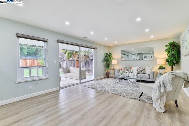 living room with light hardwood / wood-style floors