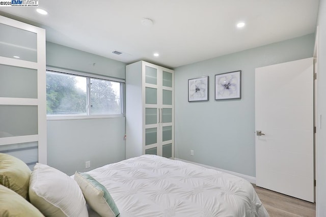 bedroom featuring light hardwood / wood-style flooring