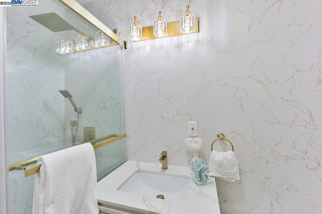 bathroom with an enclosed shower and vanity