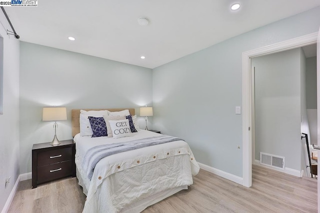 bedroom featuring light hardwood / wood-style floors