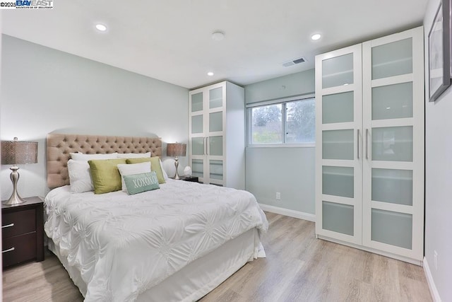 bedroom featuring light wood-type flooring