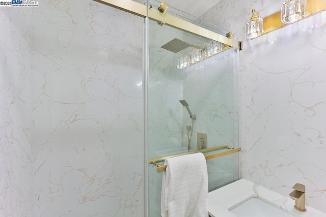 bathroom with vanity and walk in shower