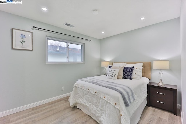 bedroom with light wood-type flooring