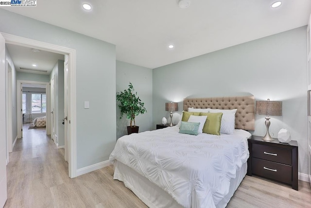 bedroom featuring light wood-type flooring