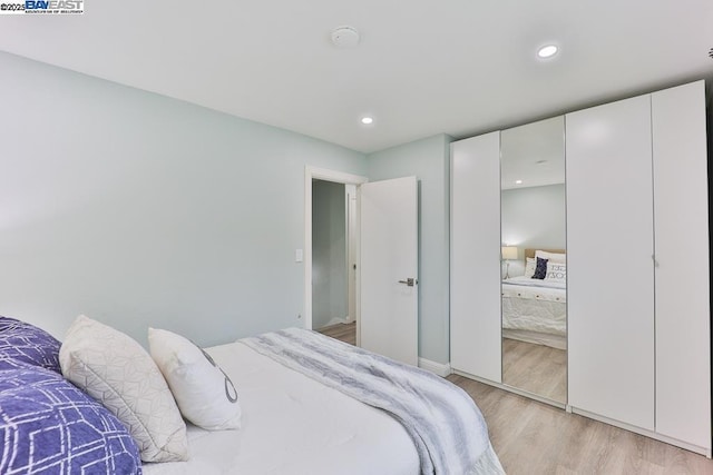 bedroom with light hardwood / wood-style flooring