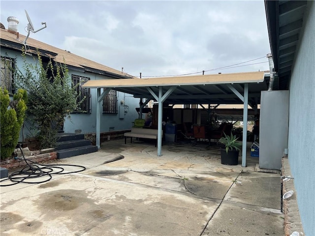 view of parking / parking lot with a patio