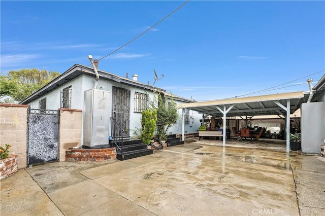 exterior space with a carport