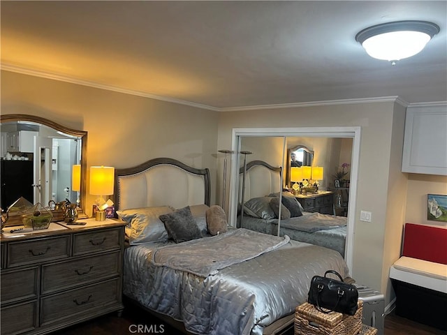 bedroom with ornamental molding and a closet