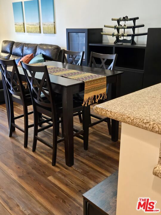 dining space featuring dark hardwood / wood-style flooring