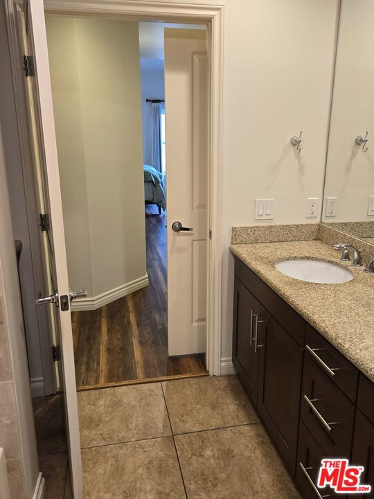 bathroom with vanity and tile patterned flooring