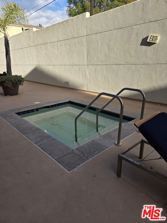 view of pool featuring a community hot tub