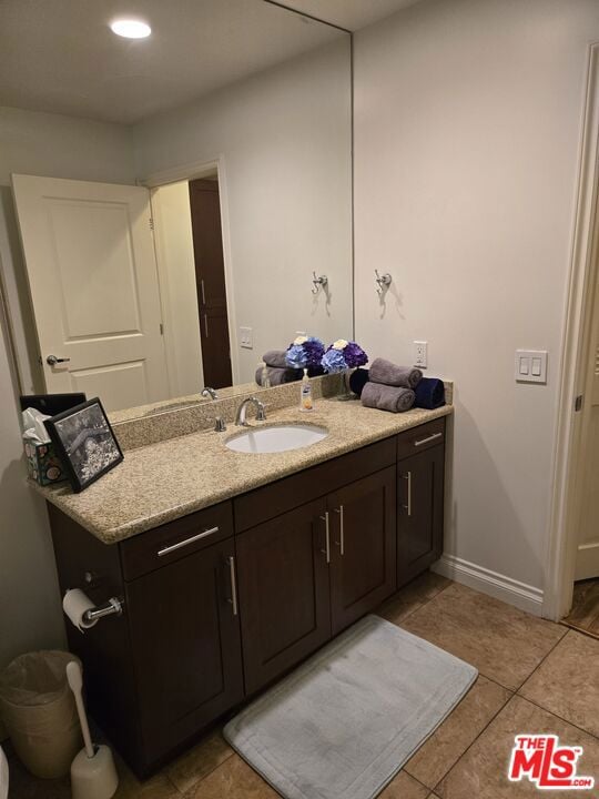 bathroom with vanity and tile patterned flooring