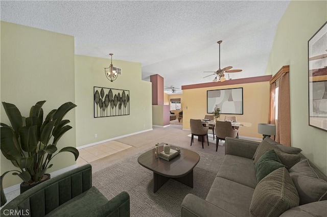 carpeted living room featuring vaulted ceiling, ceiling fan with notable chandelier, and a textured ceiling