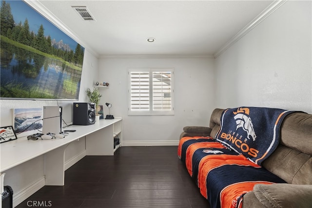 office with dark wood-style flooring, built in study area, visible vents, and crown molding