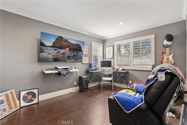 office area with baseboards, wood finished floors, visible vents, and crown molding