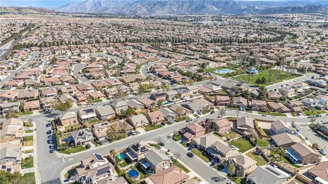 birds eye view of property with a residential view and a mountain view