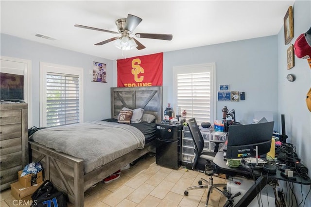 bedroom featuring a ceiling fan and visible vents