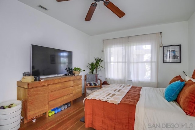 bedroom with hardwood / wood-style flooring and ceiling fan