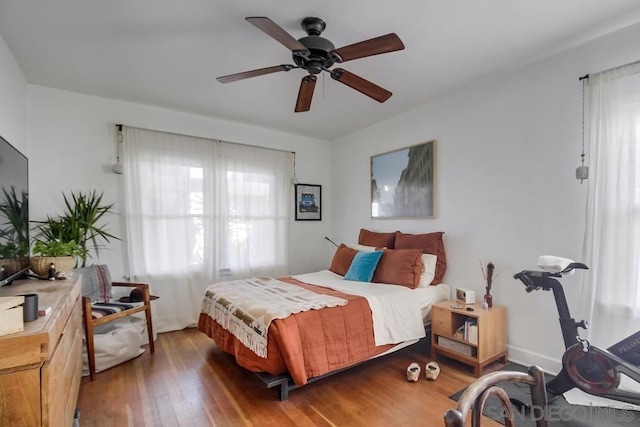 bedroom featuring hardwood / wood-style flooring and ceiling fan