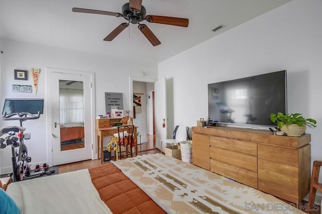 bedroom with light hardwood / wood-style floors and ceiling fan