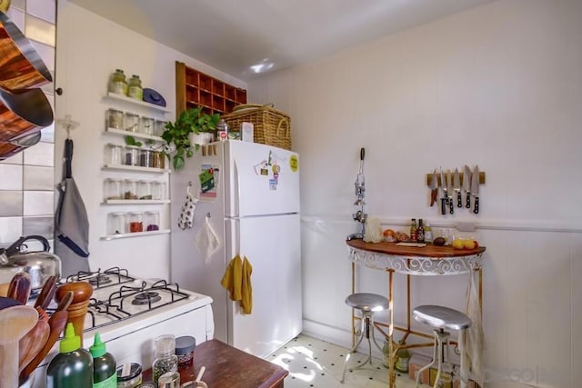 kitchen featuring white fridge